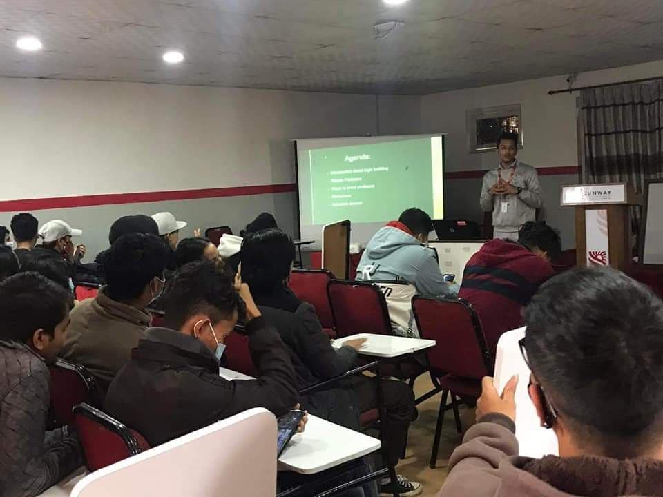 Prabin teaching a programming workshop